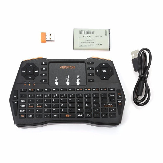 Black wireless mini keyboard with a touchpad, USB receiver, and charging cable.