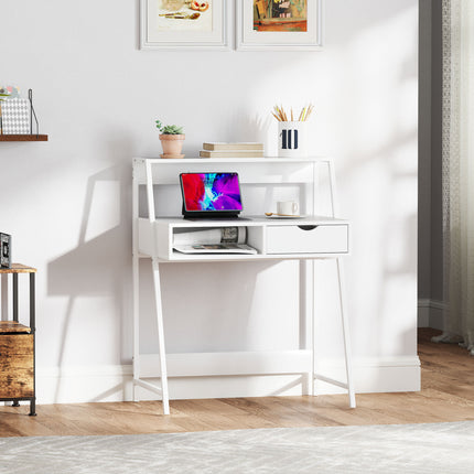 White home office desk with shelves and a drawer, holding a tablet and decor.
