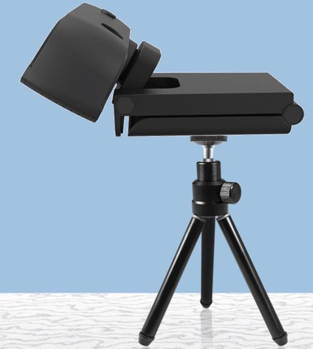A black webcam with a built-in microphone is mounted on a small black tripod.