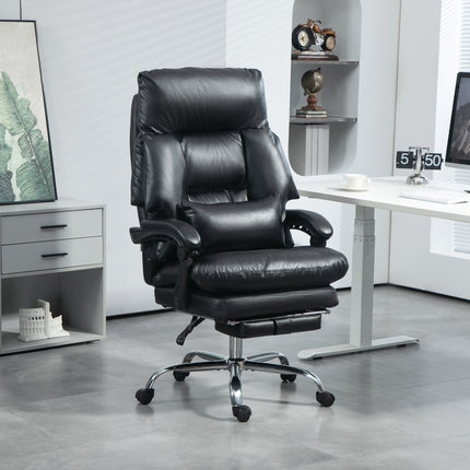A black overstuffed office chair with a footrest and chrome base is in a modern office.